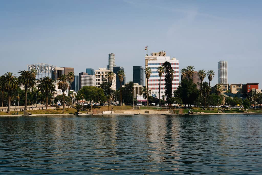 The Los Angeles skyline and the lake at MacArthur Park, in Westlake, Los Angeles, California.