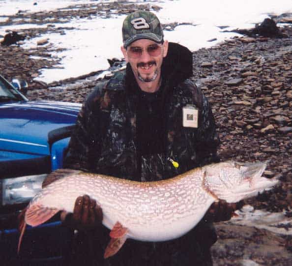 An angler holds the Pennsylvania state record northern pike.
